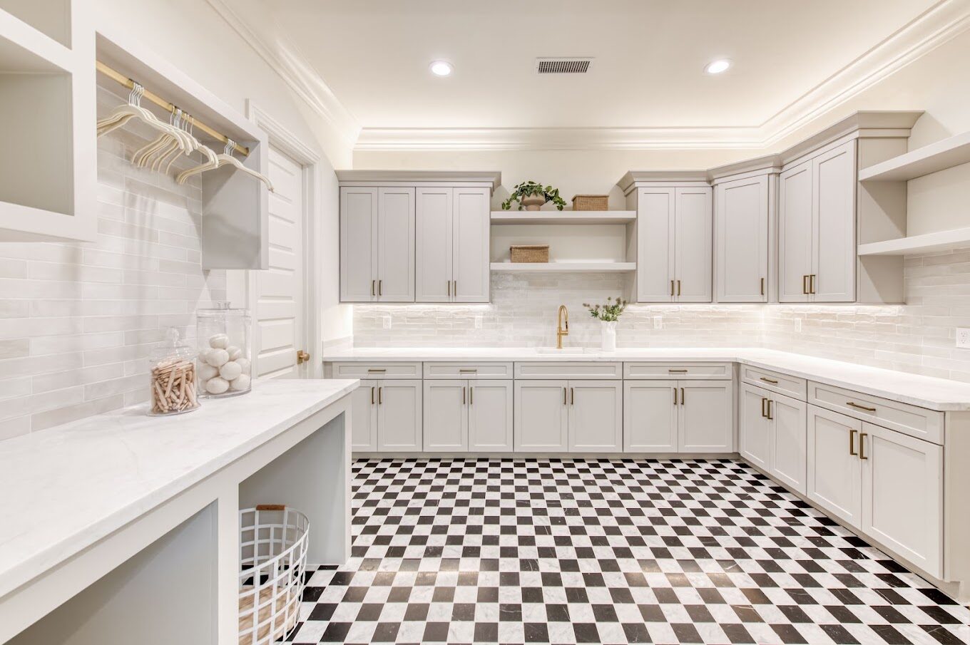 Laundry and mudroom cabinetry with checkerboard tile floor