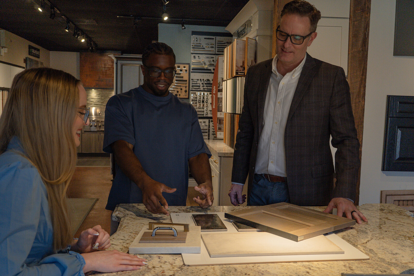 Team reviewing door samples and finishes with a client